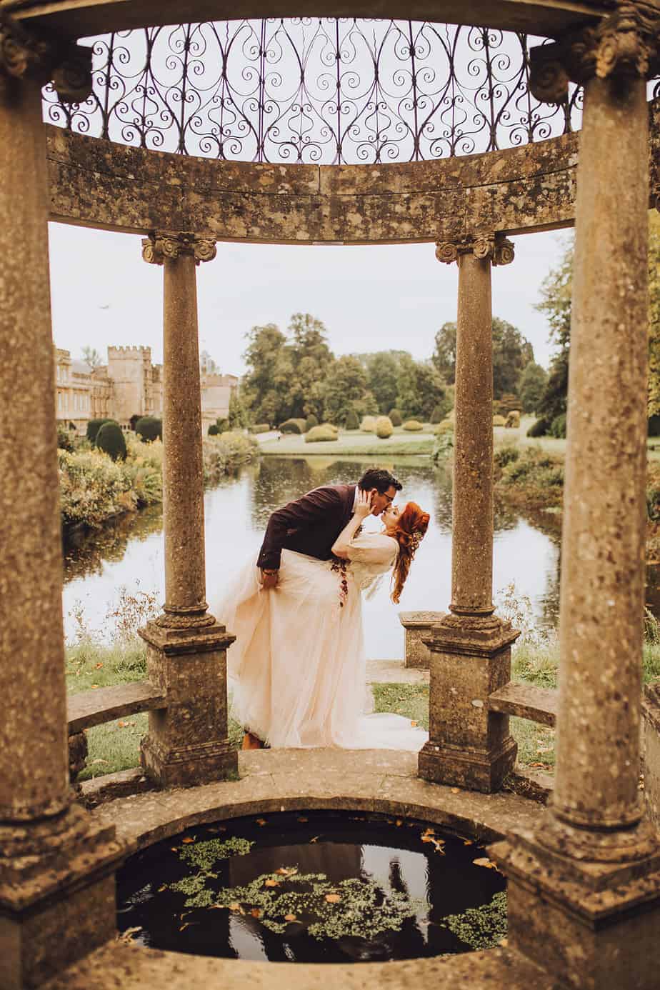 bride and groom kissing in forde abbey