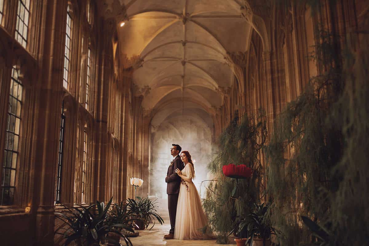 bride and groom in cloisters at forde abbey