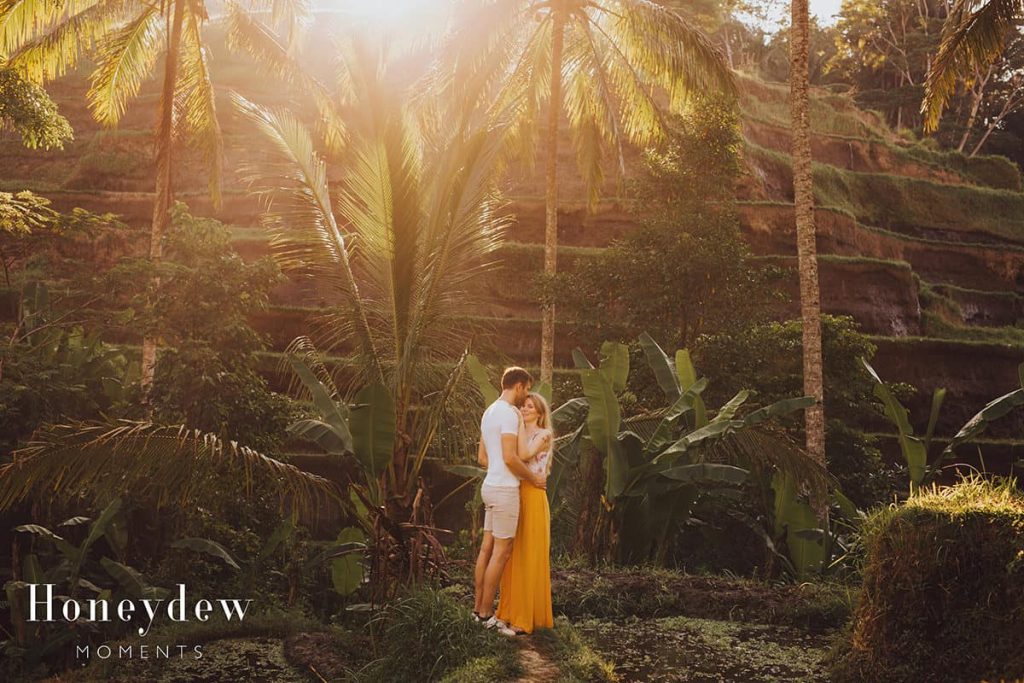 sunrise as a couple cuddle in Tegalalang Rice Terraces