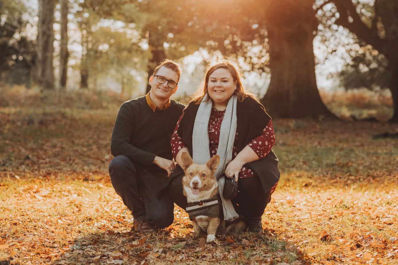 Couple and their corgi dog in autumn at their forest of dean engagement shoot