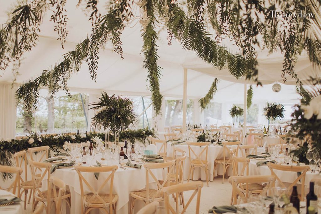 Gileston Manor wedding reception marquee filled with foliage in a tropical theme