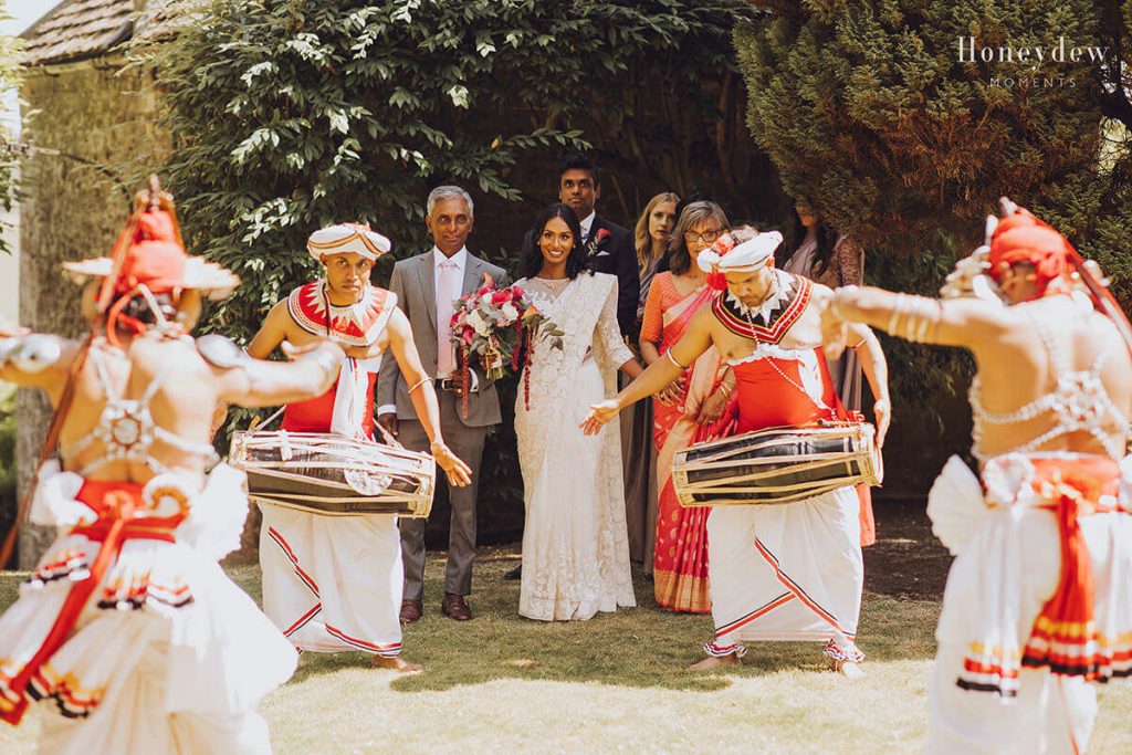 bride arriving at hamswell house to a sri lankan poruwa ceremony