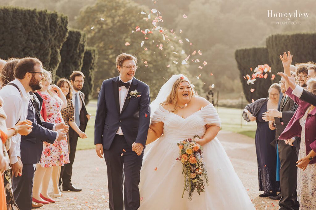 newlyweds walk under confetti at st audries park