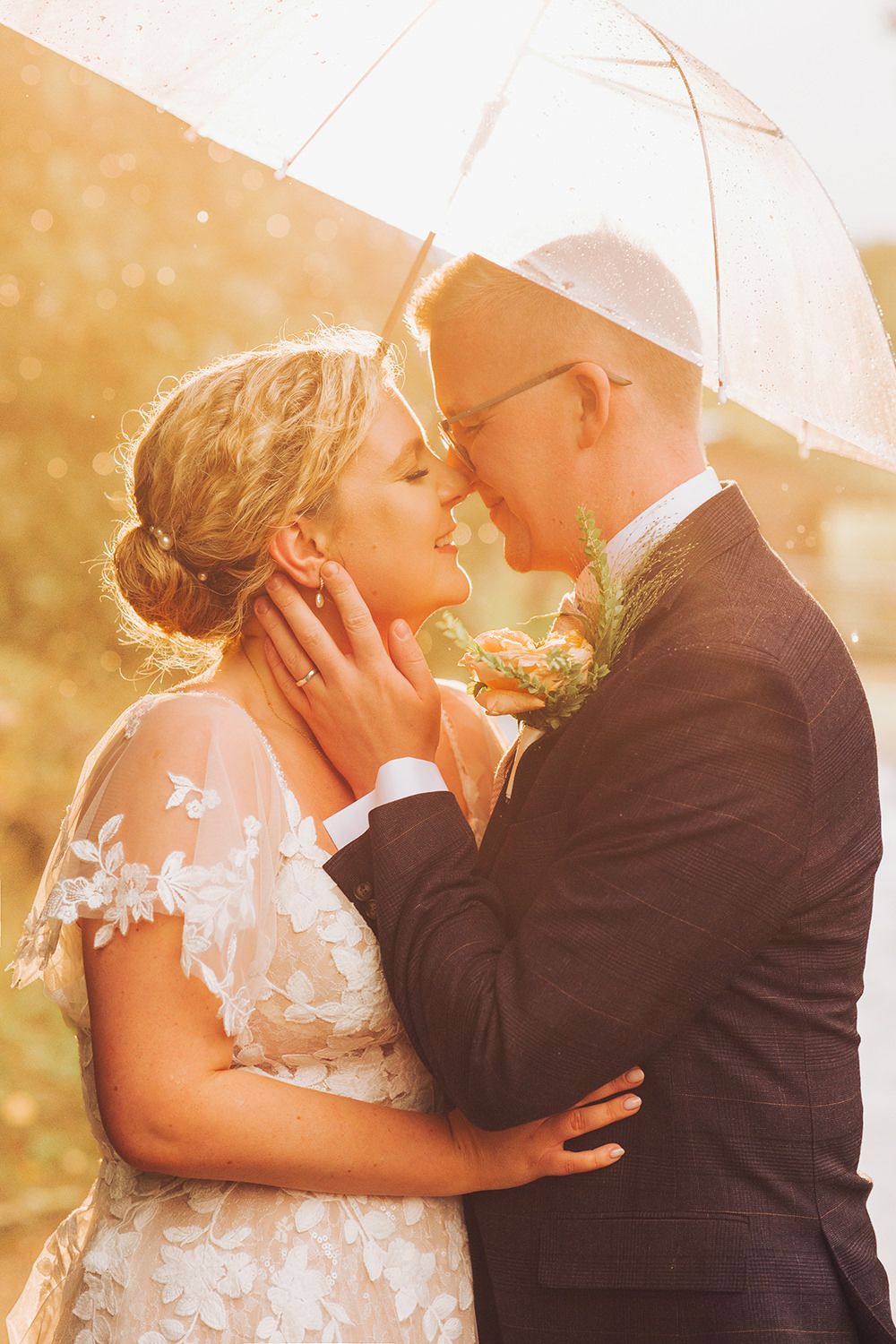 golden hour in the rain at burley manor under an umbrella
